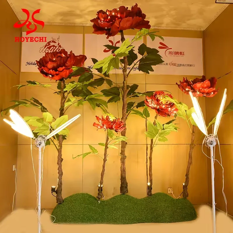 Tall red illuminated peony flowers arranged as a commercial floral display