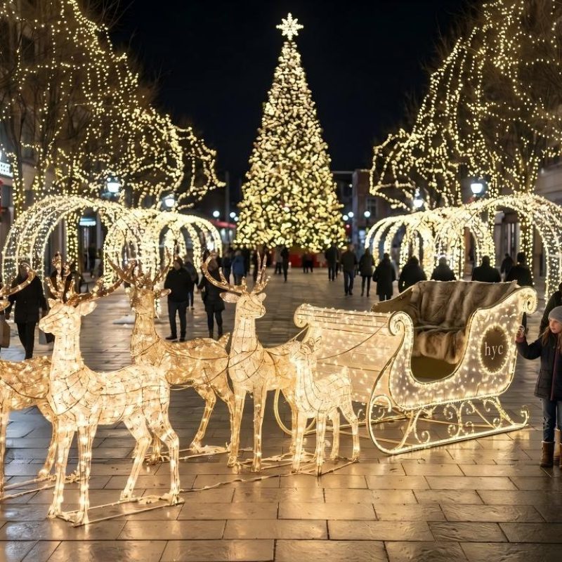 Arranjo de renas e trenó num expositor comercial de Natal com espaço para fotografias
