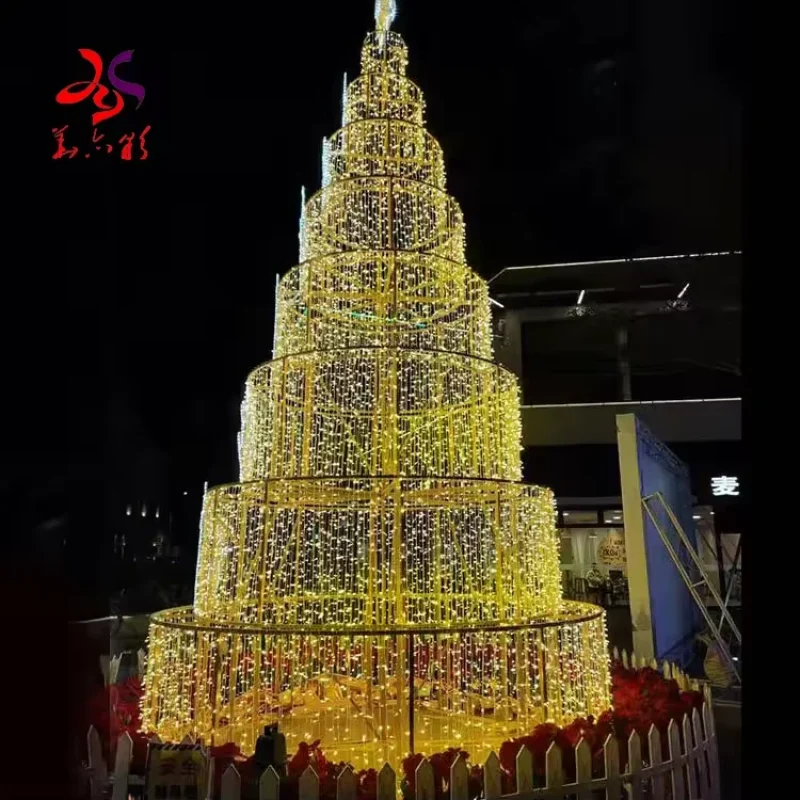 Giant tiered Christmas light tree with stacked circular frames and warm white LEDs